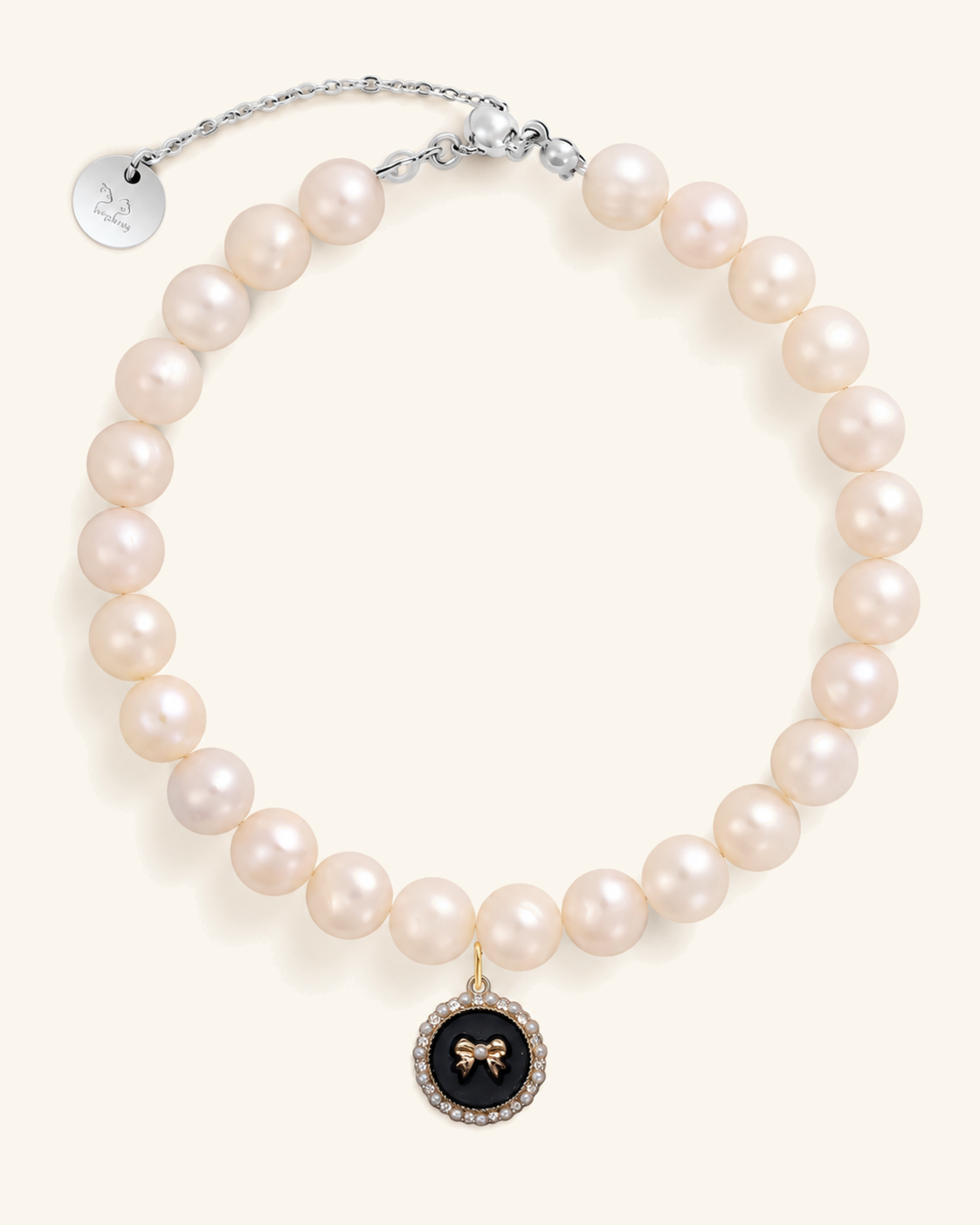 Freshwater pearl necklace for cats with a black bow charm and silver clasp