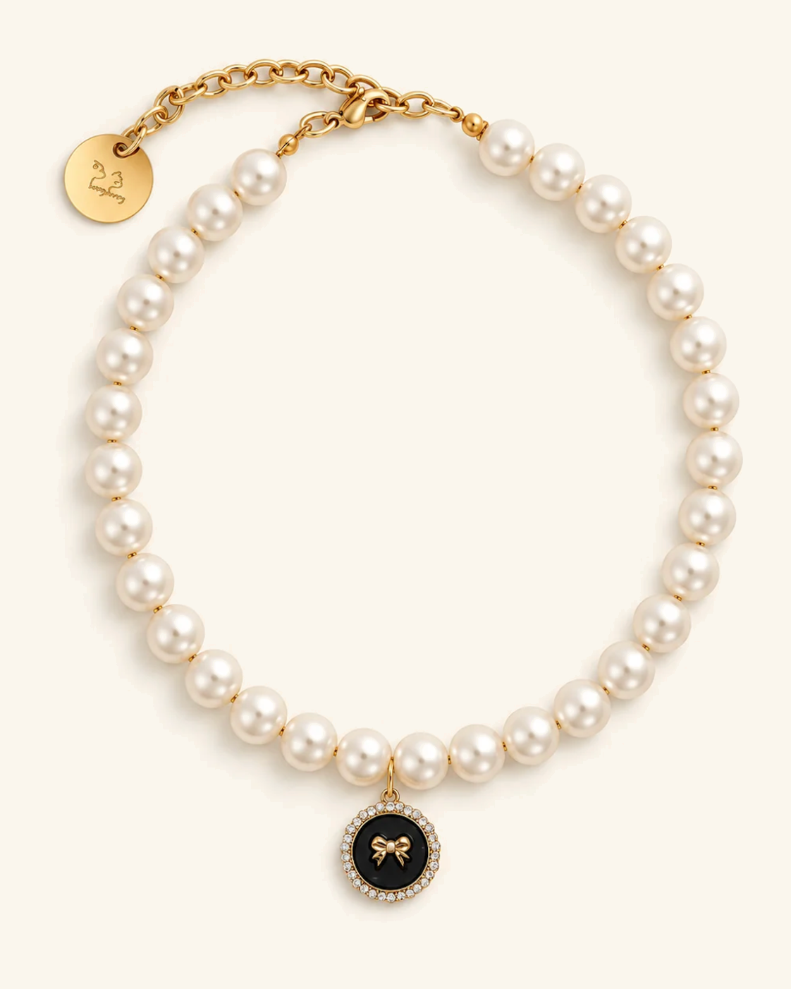 Faux pearl necklace for you with a black bow charm and gold clasp