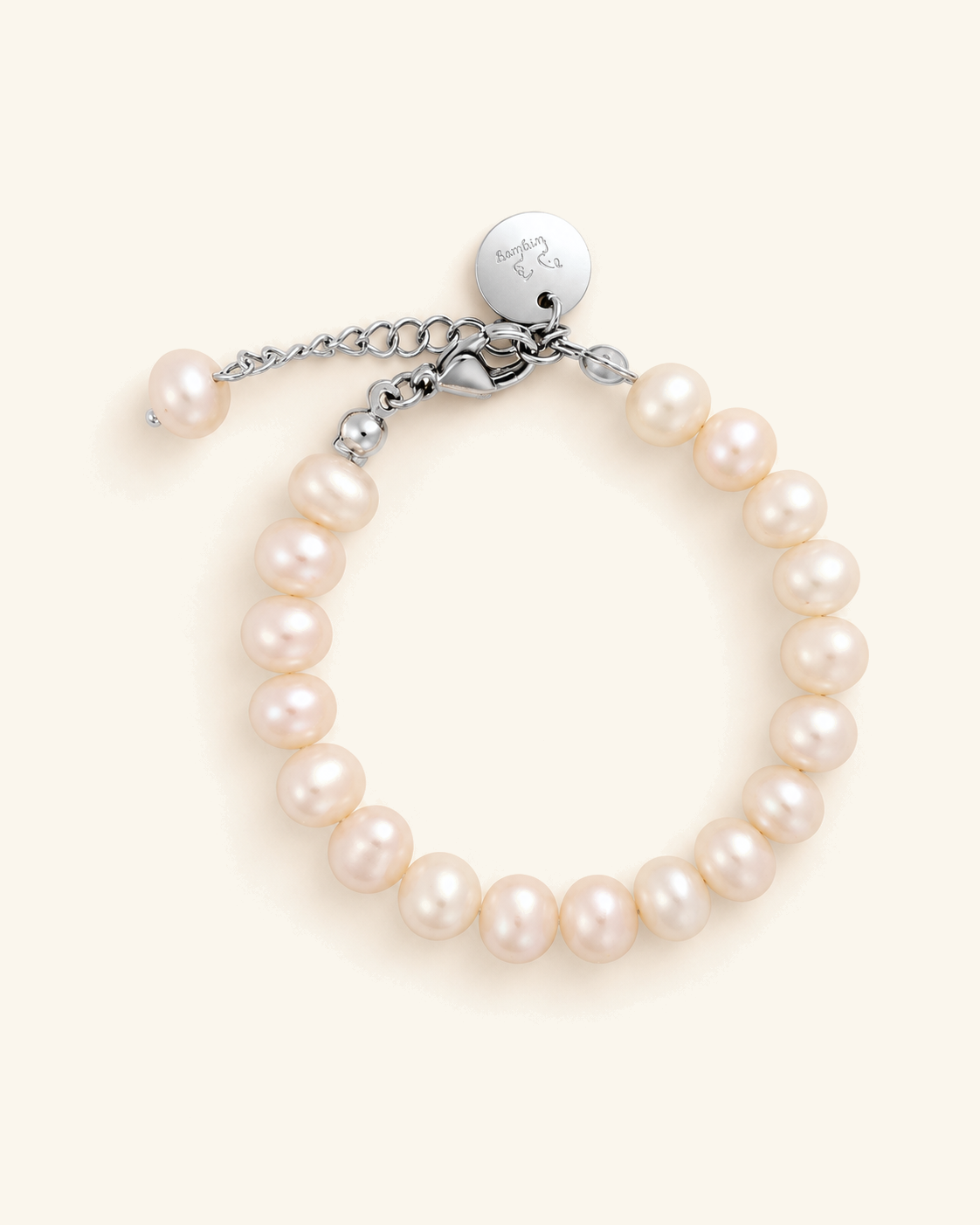 Freshwater pearl bracelet with a silver clasp and engraved tag