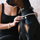 Woman and her Doberman wearing matching freshwater pearl jewelry