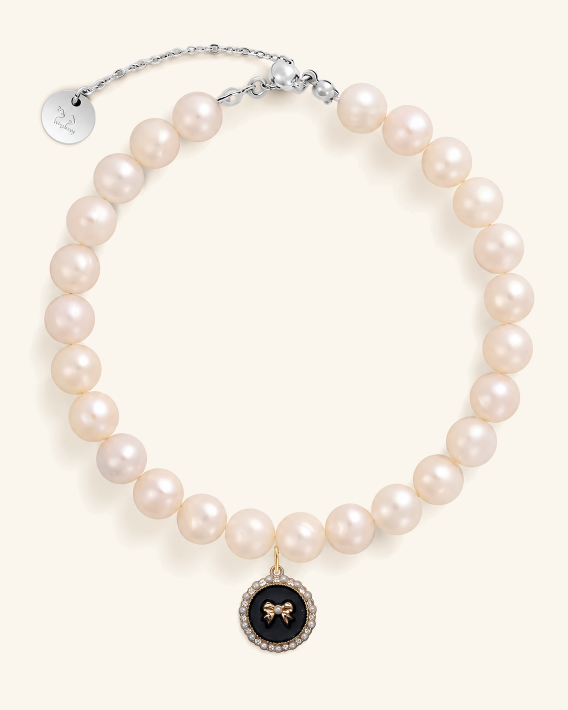 Freshwater pearl necklace for you with a black bow charm and silver clasp