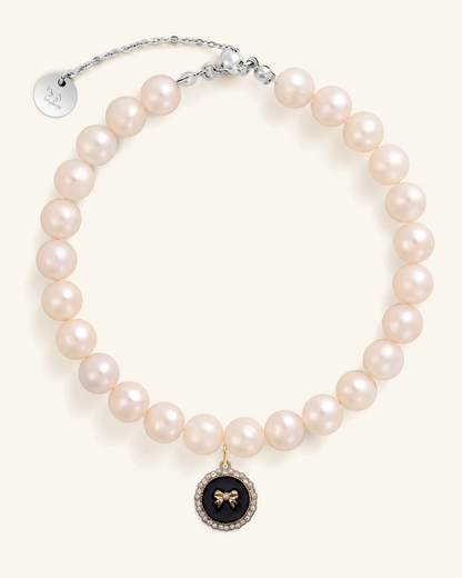 Freshwater pearl necklace for you with a black bow charm and silver clasp